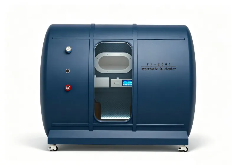 Blue hard shell hyperbaric chamber with a transparent door, oval viewing window, padded interior and pressure gauge.