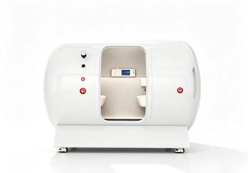 White four person hard shell hyperbaric chamber with cream seats, quilted interior and an interior control panel.